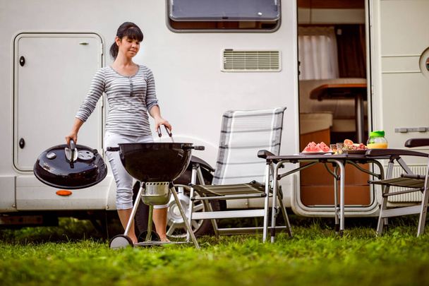 Family vacation travel RV, holiday trip in motorhome, Caravan car Vacation. Picnic with outdoor barbecue. - Foto, Imagen