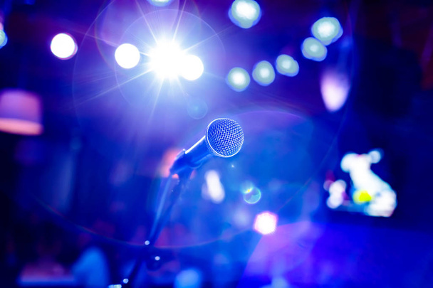 Public performance on stage Microphone on stage against a background of auditorium. Shallow depth of field. Public performance on stage. - Φωτογραφία, εικόνα