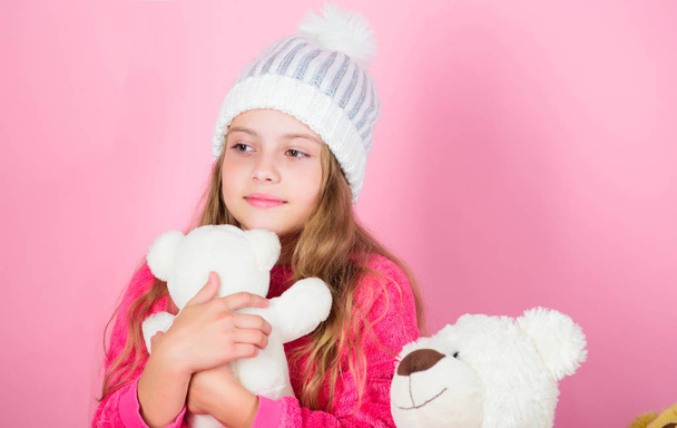 Toy every child dreaming. Kid little girl play with soft toy teddy bear on pink background. Happy childhood concept. Child small girl playful hold teddy bear plush toy. Why kids love stuffed animals - Fotoğraf, Görsel
