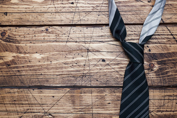 Father's Day Concept. Striped tie on wooden background with copy space - Foto, Imagem
