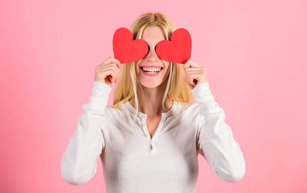 Girl hold heart symbol love and romantic pink background. Girl cheerful fall in love. Love is blind. Valentines day has traditionally been seen as more significant for women. Woman celebrate love - Fotografie, Obrázek