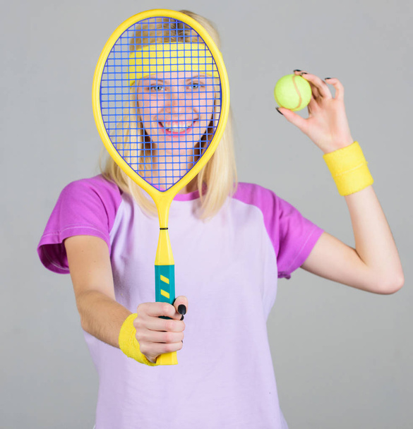 Tennis sport and entertainment. Active leisure and hobby. Girl fit slim blonde play tennis. Sport for maintaining health. Active lifestyle. Woman hold tennis racket in hand. Tennis club concept - Photo, Image