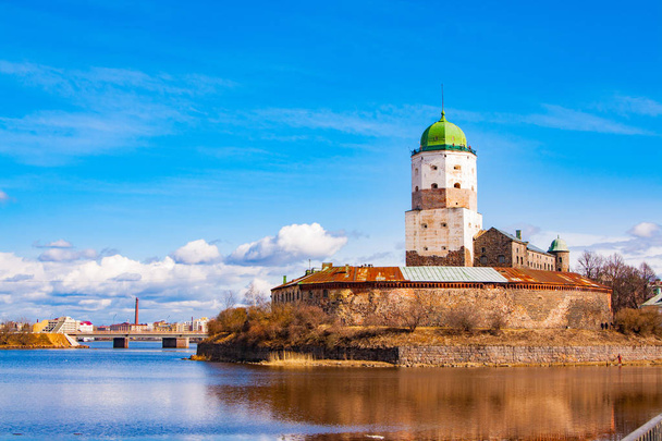 Sightseeing of Russia. Beautiful spring view to historical Vyborg ancient castle - medieval, famous fort in Vyborg town, a popular architectural landmark, LEningrad Region, Vyborg, Russia - Fotó, kép
