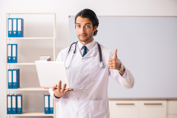Young doctor in front of whiteboard  - Photo, Image