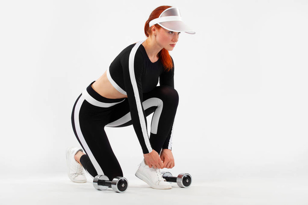Sporty fit woman, athlete with dumbbells prepearing to fitness exercising on white background. - Fotoğraf, Görsel