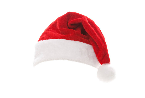 Joulupukin hattu valkoisella pohjalla. Hyvää joulua Hollidays. Joulupukin hattu studiossa. Joulu, joulu, talvi konsepti
. - Valokuva, kuva