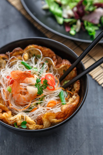 Thai style rice noodles salad with shrimps and omelette, cloxe view selective focus - Fotó, kép