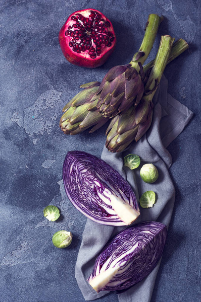 Artichokes, cabbage and pomegranate, fresh veggies vegan cooking ingredients for healthy eating. Food bacgkround - Fotografie, Obrázek
