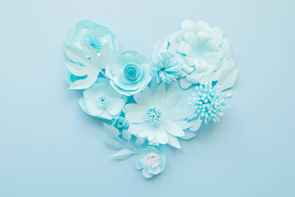 Heart from blue paper flowers on blue background. Cut from paper. - Foto, Imagem