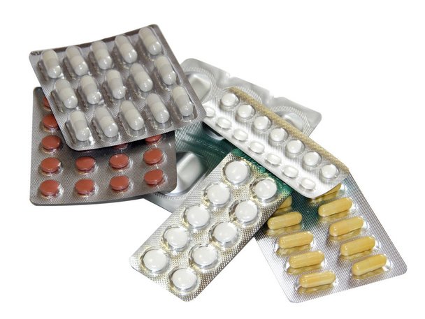 Набор разноцветных таблеток в белых пузырьков пакеты изолированы на белом
 - Фото, изображение