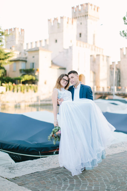 Romantic couple in love having fun embracing and laughing in Sirmione, Italy. Love in Italy - Photo, image
