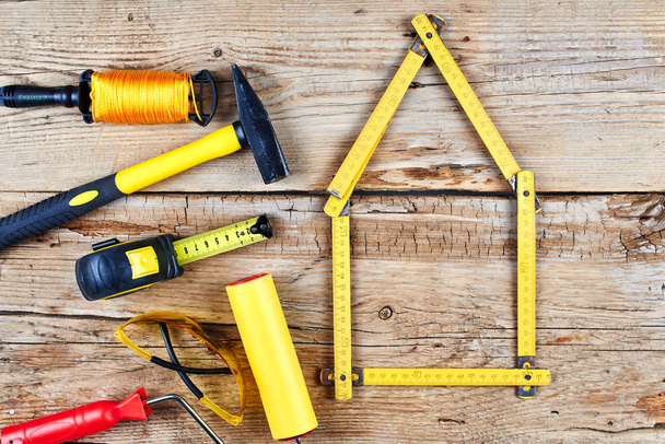 set of construction tools on a wooden background top view - Photo, Image