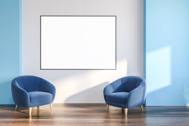 Interior of minimalistic living room with white and blue walls, dark wooden floor and two blue armchairs with horizontal poster above them. 3d rendering mock up - Photo, Image