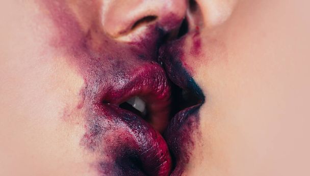 Lipstick kiss. Two beautiful sexy lesbians in love. Red purple lip and set mouth. Sexy background. Woman lips. Close up macro with beautiful woman mouth. - Photo, Image