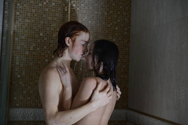 loving couple kissing in the shower - 写真・画像