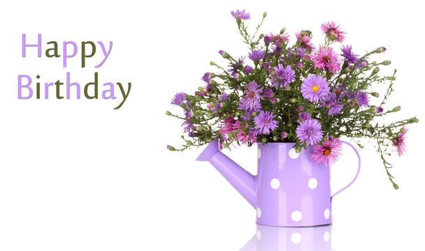 beautiful bouquet of purple flowers in watering can isolated on white - Foto, Bild