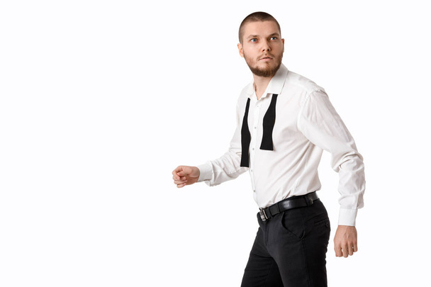 young bearded man in a white shirt and bow tie - 写真・画像