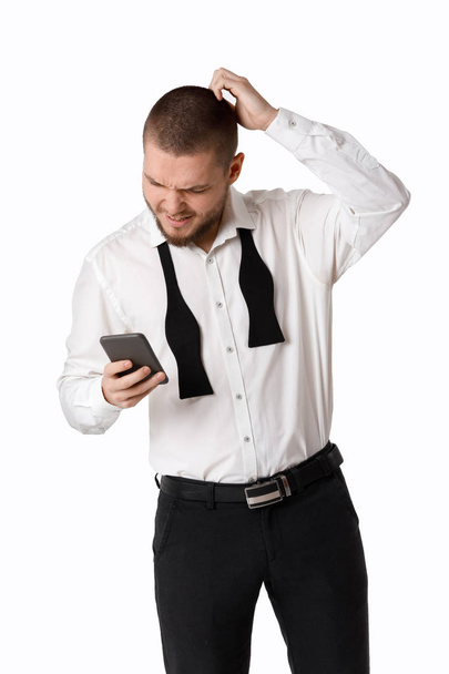 portrait of young bearded businessman uses smartphone. - Фото, зображення