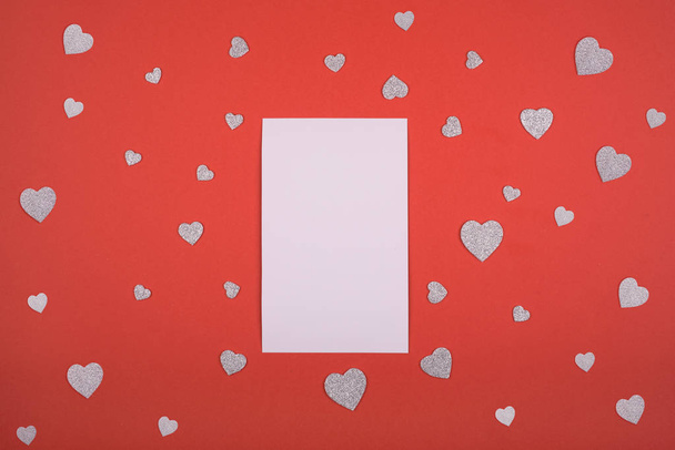Red background many hearts place for text white paper. Valentines day, mothers day, holiday. - Foto, Imagen