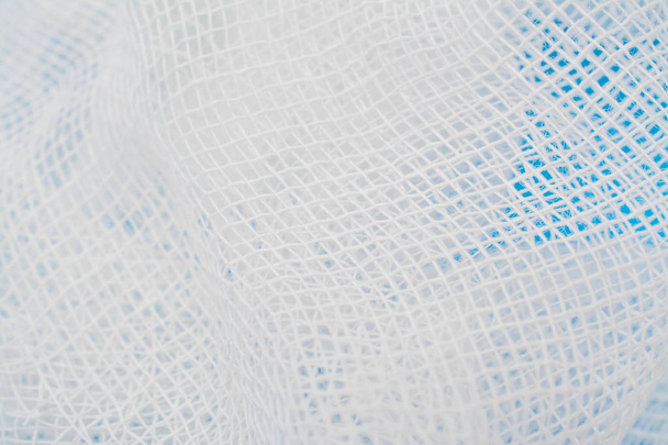 medical bandage texture on a blue background - Valokuva, kuva