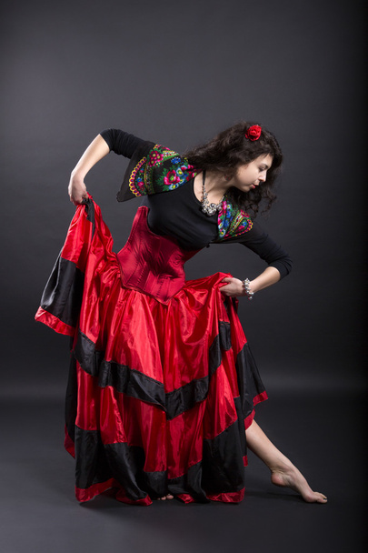 Young woman make step in spanish traditional clothes - Фото, изображение