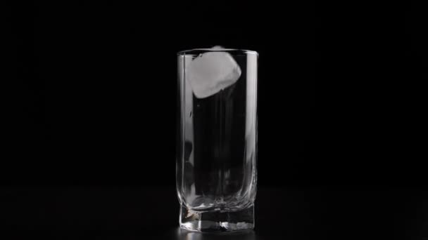 Pouring soda in glass with ice - Video, Çekim
