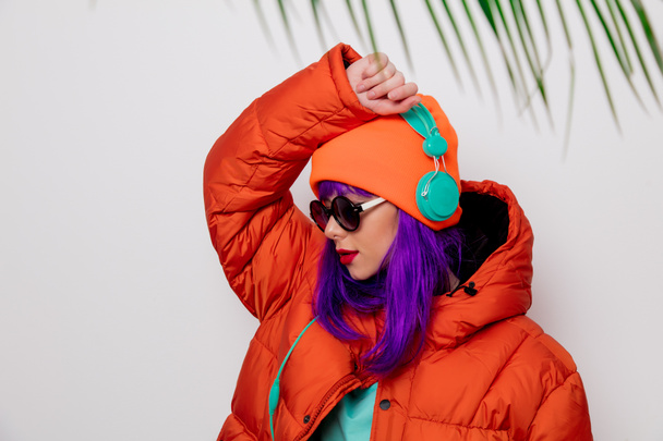 girl with purple hair in jacket with headphones - Foto, Imagem