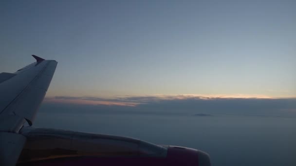 View of flying airplane wing through plane window - Felvétel, videó