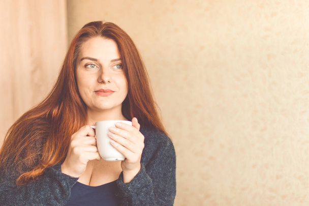 Young woman enjoying morning coffee  - Fotografie, Obrázek