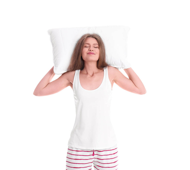 Happy woman in pajamas with pillow on white background - Foto, immagini