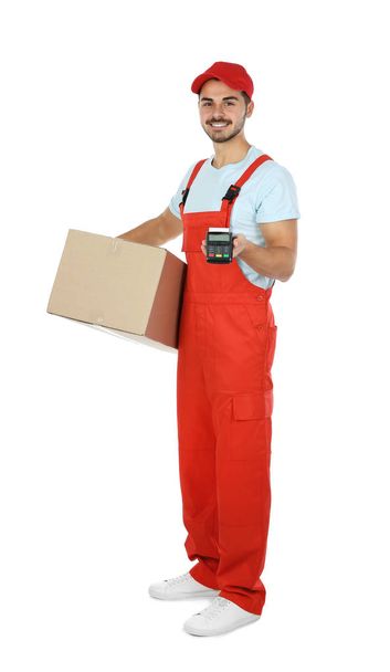 Male courier with parcel and payment terminal on white background. Space for text - 写真・画像
