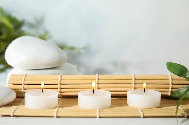 Spa composition with burning candles on table - Photo, Image