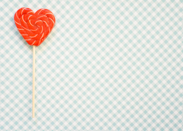 Red and pink lollipop. Candy in the form of heart. - Foto, Imagem