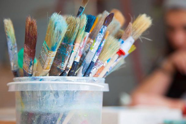 Old painter's brushes, dirty to the edge. - Photo, image