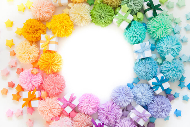 Garland and a wreath of colored pompons. Bright yarn pastel colors. - Foto, Imagem