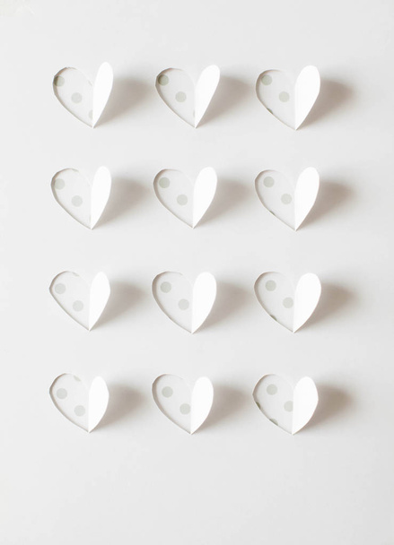 Paper hearts cut from paper. - Zdjęcie, obraz