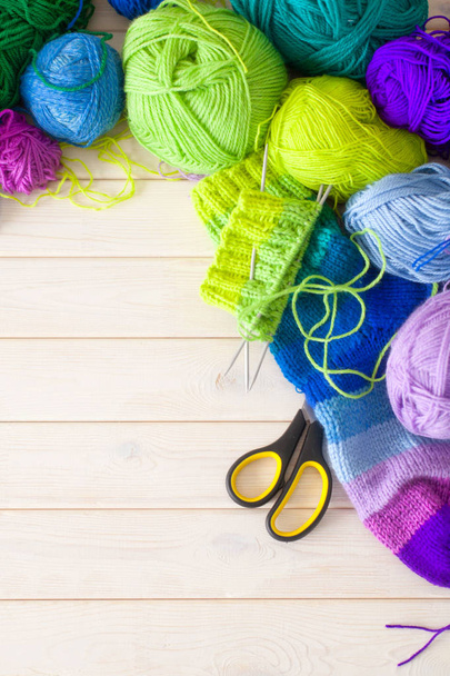 Closeup of basket with colorful yarn clews. Knitted Socks. - Фото, зображення