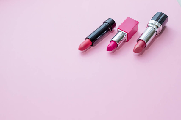 Set of lipstick isolated on pink background. Red, pink, wine, vinous.. Beauty cosmetic collection. Fashion trends in cosmetics with bright lips delisious textures. Colorful Tones,Lipstick tints - Photo, Image