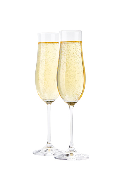 Glasses of sparkling champagne isolated on white.Merry Christmas and Happy New Year concept - Photo, Image