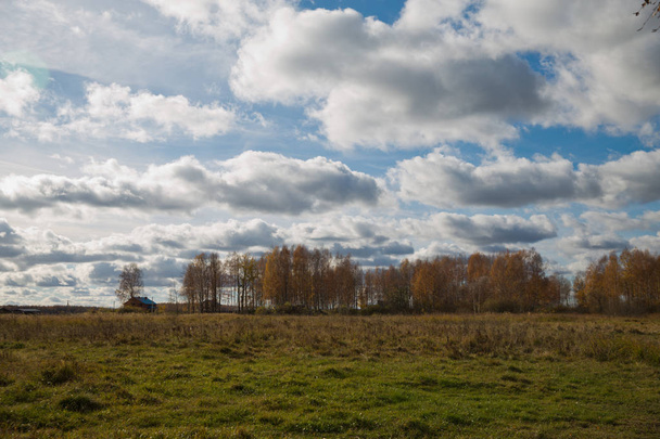 Dramatic clouds over the field in the countryside - Fotoğraf, Görsel