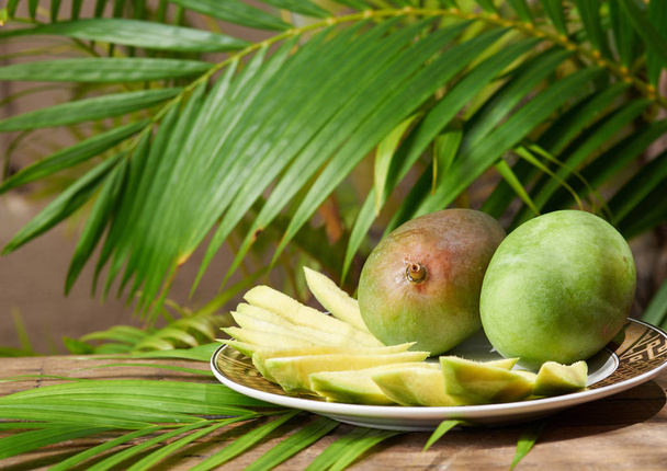 Green mango slices outdoor - Фото, изображение