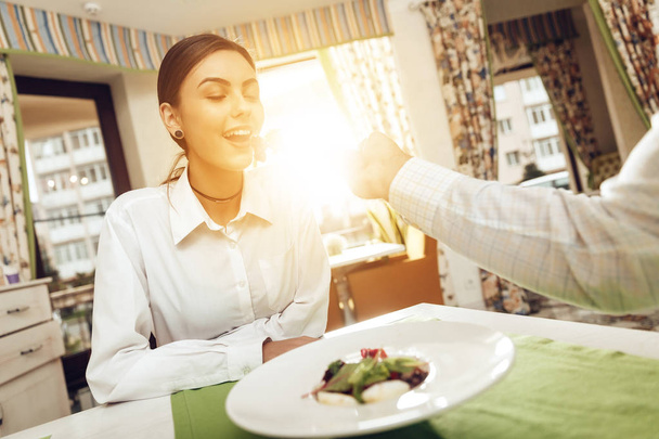 Happy man and woman have lunch in a restaurant - Foto, Imagen
