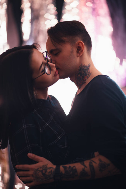 guy and the girl kiss closeup on a light background - 写真・画像