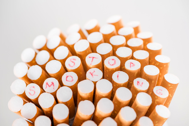 Studio shot of cigarettes isolated on grey, stop smoking concept - Photo, Image