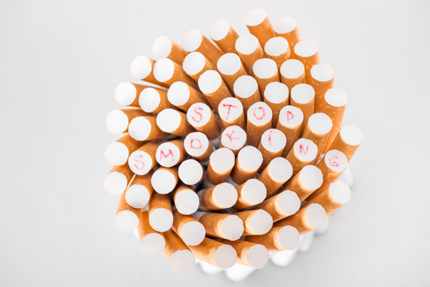 Top view of cigarettes isolated on grey, stop smoking concept - Photo, Image