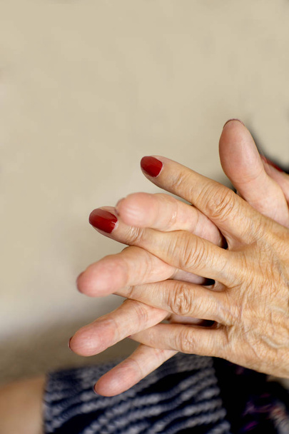 Hands of old woman and elderly caregiver - Φωτογραφία, εικόνα