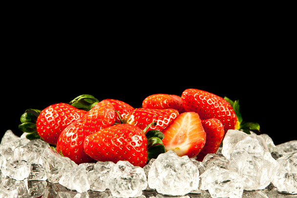 strawberry on black background. strawberries with ice cubes on - Photo, image