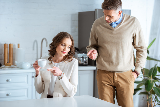 adult couple arguing during breakfast in morning - Photo, Image