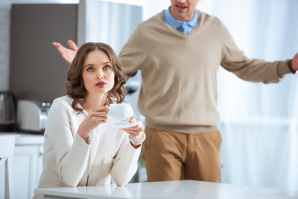 adult couple arguing during breakfast in morning - Photo, Image