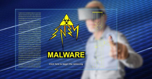 Homem com fone de ouvido vr tocando um conceito de malware em uma tela sensível ao toque com o dedo
 - Foto, Imagem
